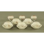 A collection of early 19th century New Hall tea bowls and saucers, five saucers and eight tea bowls.