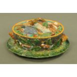 A 19th century Minton game pie dish with cover, decorated with mallard, hare and foxes,