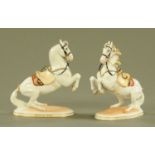 A pair of Augarten Vienna porcelain models of rearing Lipizzaner horses,
