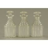 A set of 3 George III glass decanters, each with cut glass stopper. Height 24.5 cm.