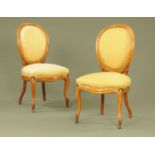 A pair of Victorian walnut occasional chairs, with cameo backs,