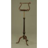 An Edwardian mahogany music stand,