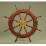 A large ships wheel, with centre brass boss. Overall diameter 108 cm.