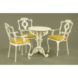 A Victorian style painted metal garden table, with three accompanying chairs, table diameter 58 cm.