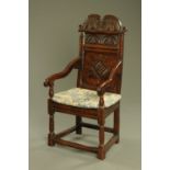 A 17th century oak Wainscot chair with leaf carved cresting rail,