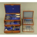 An oak cutlery canteen, with some cutlery, and a cased set of 12 dessert knives and forks.