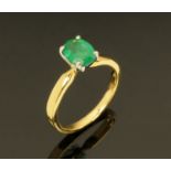 An 18 ct gold emerald ring, emerald +/- 1.29 carats.