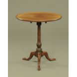 A George III mahogany tripod table, with moulded edge, snap action,