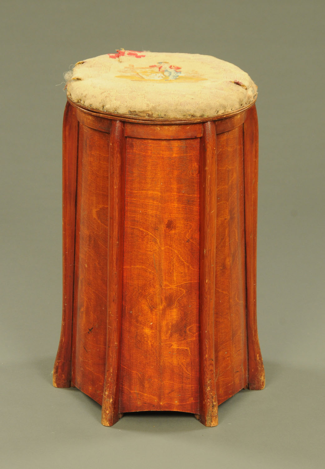 A late 19th century cylindrical linen basket, with shaped side supports.