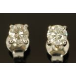 A pair of 18 ct white gold diamond stud earrings, diamonds +/- 0.62 carats.
