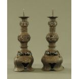 A pair of 19th century oriental metal pricket candlesticks. Height 31 cm.