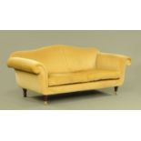 A Victorian style settee, with shaped back, two loose cushions,