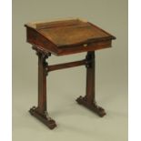 A rosewood writing desk, with brass gallery,