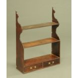An early 19th century three tier open shelf unit, fitted with two base drawers.