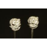 A pair of 18 ct white gold stud earrings, set with diamonds weighing +/- .61 carats.
