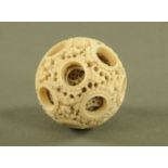 A 19th century Cantonese carved ivory concentric puzzle ball, diameter +/- 5.5 cm.