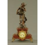 A 19th century French spelter figural mantle clock, the figure after Moreau,