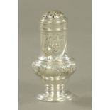 A George III embossed silver pepper pot, Samuel Wood 1762, height 10 cm,