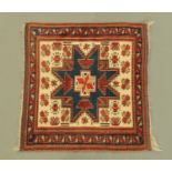 An eastern fringed rug, principal colours blue, beige and purple,