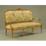 A Continental gilt painted wooden framed settee,