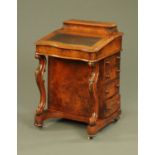 A Victorian walnut Davenport, with rear stationery compartment,