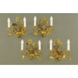 A set of four twin branch gilt wall light fittings, each width +/- 32 cm,