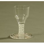 An 18th century squat glass with double air twist stem and folded conical foot, with ogee bowl.