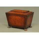 A Regency mahogany ebony strung sarcophagus shaped cellarette,