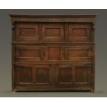 A 17th century inlaid oak court cupboard dated 1621,