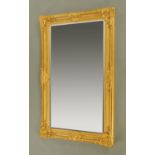 A large bevelled glass gilt framed mirror,
