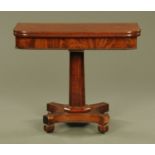 A William IV mahogany turnover top tea table, with beaded edge, faceted column and quatreform base.