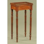 A Regency mahogany stand, with gallery and raised on turned legs.