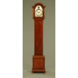 A mahogany longcase clock, with three train spring driven movement and silvered brass dial.