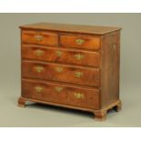 A George III oak chest of drawers,