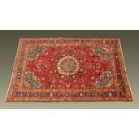 A Persian design woollen rug,