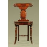 A Regency mahogany hall chair attributed to Gillows, with bowed top rail,