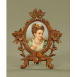 A German porcelain portrait panel of a lady, in Black Forest easel frame. Height 16 cm, width 13.