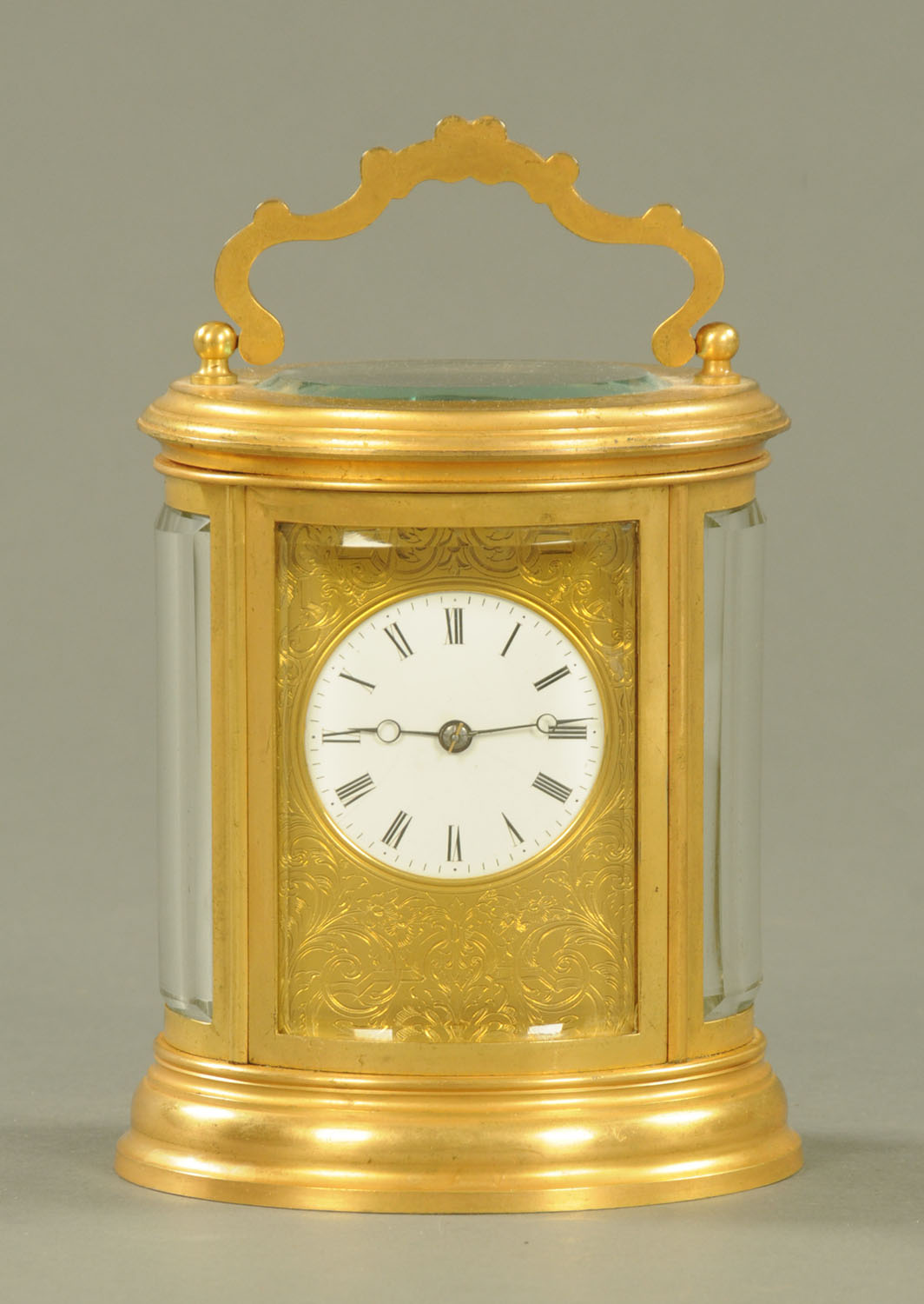 An Edwardian oval brass carriage clock,