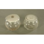 Two silver mounted dressing table jars, both etched with classical designs.