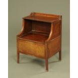 A 19th century mahogany commode, raised on legs of square section. Width 54.5 cm.