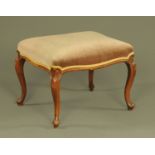 A Victorian walnut stool, with serpentine frame and raised on four cabriole legs. 62 cm x 52 cm.