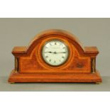 An Edwardian oak and pollard oak cased mantle clock by The Goldsmiths Company Cardiff,