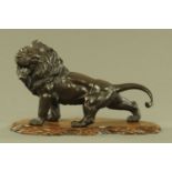 A large Chinese bronze prowling lion,