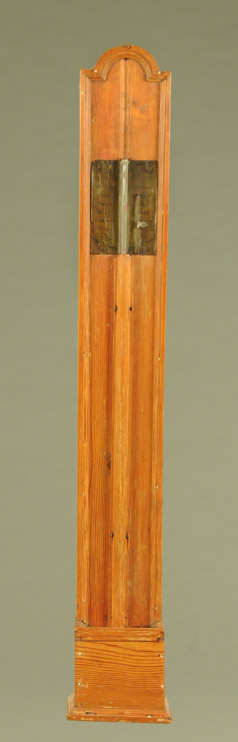 A pine cased stick barometer, with paper label and adjustable scale. Height 104 cm.
