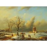 An oil painting on panel, Dutch scene in winter. 29 cm x 39 cm, in composition gilt painted frame.