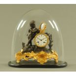 A 19th century gilt metal clock under dome,
