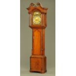 An early 19th century oak and mahogany crossbanded longcase clock with eight day striking movement