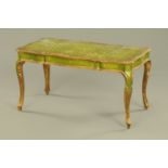 A Venetian green painted and gilt low table, raised on cabriole legs. width 98 cm.