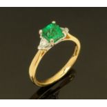 An 18 ct gold oil free emerald and diamond set ring, emerald +/- 0.