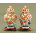 A pair of 19th century Imari porcelain lidded vases,